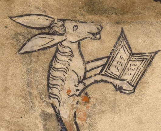 Medieval manuscript illustration of a donkey laughing and holding a book with its front hooves.