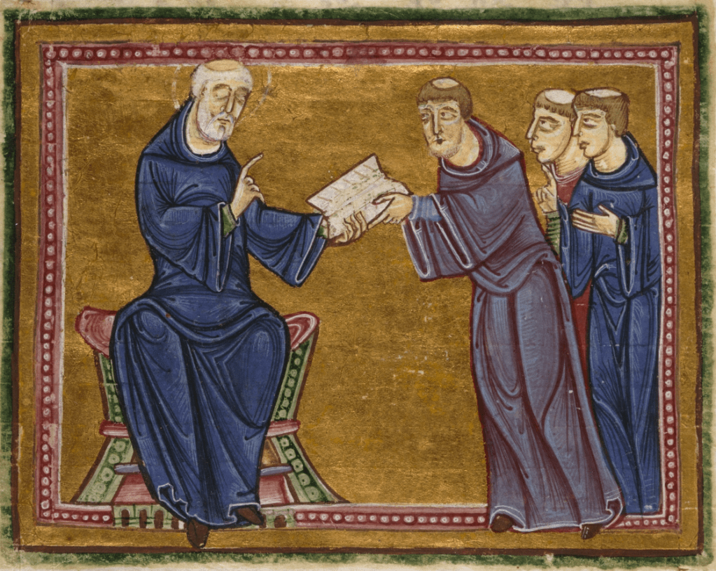Medieval manuscript image of an older monk in a chair passing a book to a group of three younger monks standing before him.