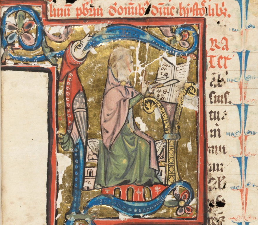 Medieval manuscript image of a monk writing in a manuscript with a quill and penknife, with a hooded monstrous creature forming part of the large letter F in which he sits.