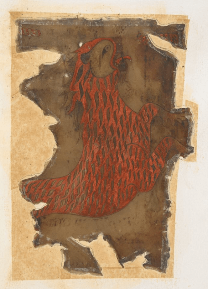 A badly damaged piece of medieval parchment attached to modern paper; what remains of the parchment has an illustration of a red-orange lion.