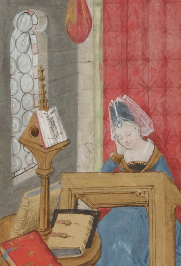 Medieval manuscript image of a woman sitting at a desk, head in hand and eyes closed; there is a table with a pile of books nearby, one of which is open for reading, and to her left is a window of glass roundels.