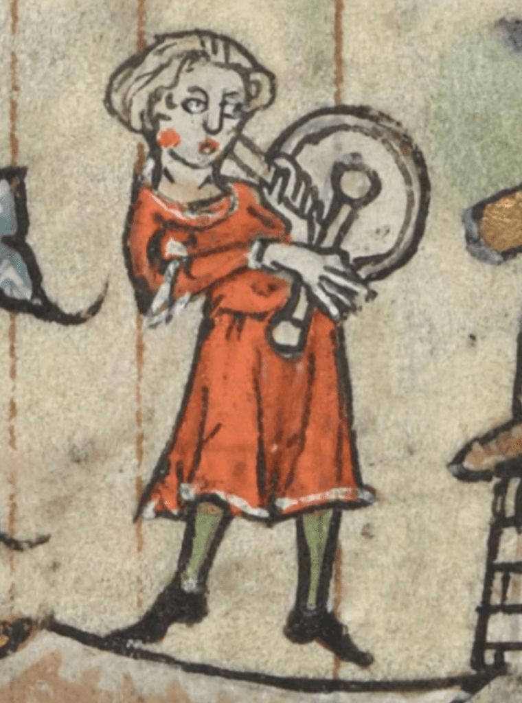Medieval manuscript image of a rosy-cheeked youth wearing a red tunic and green stockings, beating a hand drum with a mallet.