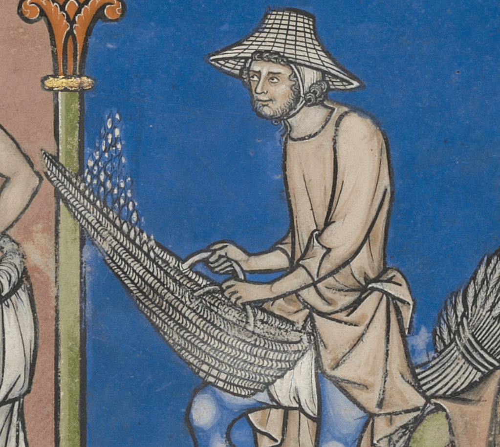 Medieval manuscript image of a man sifting grain using a winnowing fan.