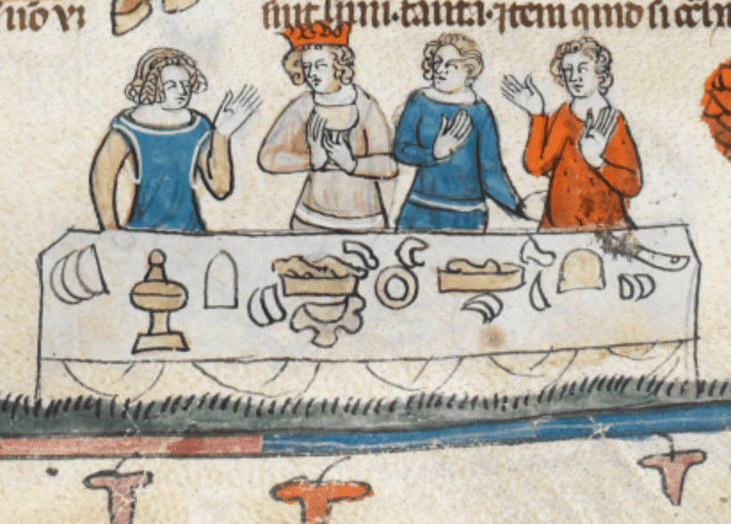 Medieval manuscript image of four people at a long table that holds dishes and vessels for food and drink; they appear to be conversing, gesturing with their hands, and one of them wears a crown.