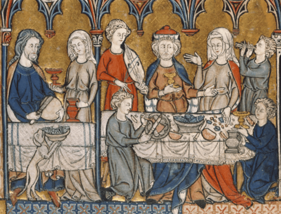 Medieval manuscript image of people gathered around a table, eating and drinking and conversing; musicians perform in the background and in the foreground a dog steals some fish from a plate.