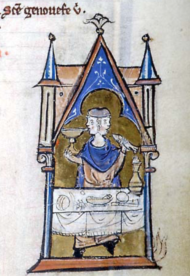 Medieval manuscript illustration of a two-faced man wearing a hat, drinking from a vessel in his right hand and raising a fish to his mouth in his left; he stands behind a table of food and dishes.