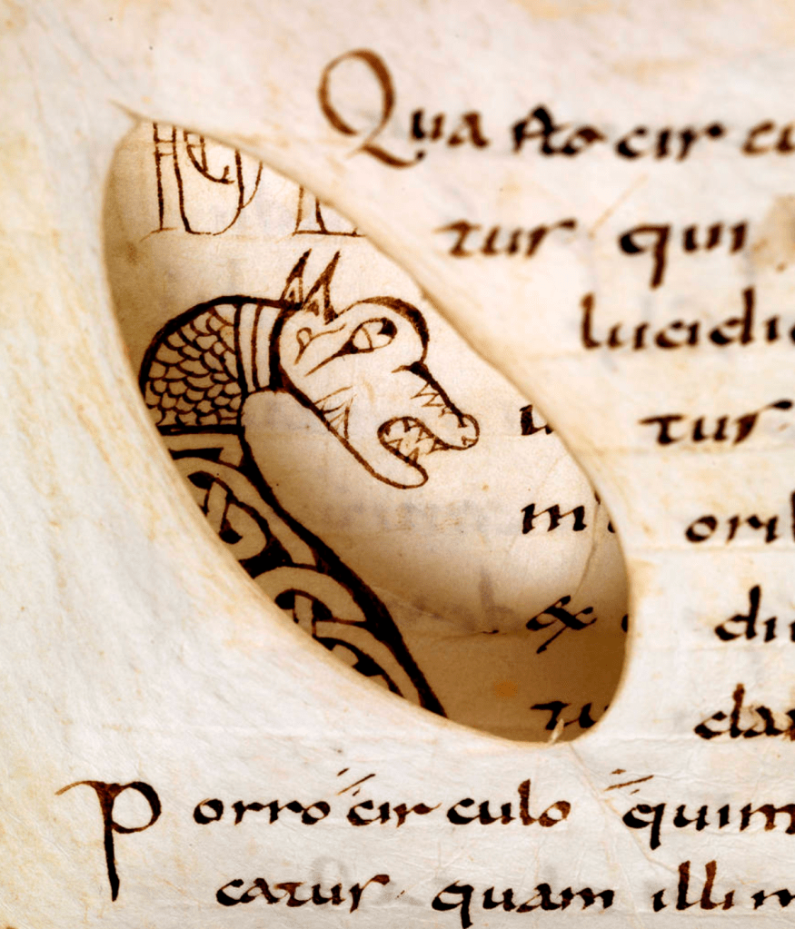 A hole in a page of a medieval manuscript reveals a dragon on the page beneath.