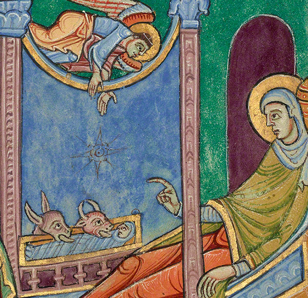 Medieval manuscript image of a haloed virgin Mary pointing to baby Jesus, eyes open, in a manger, with a donkey and a cow licking his body; a star shape hovers between the baby and an angel directly above.
