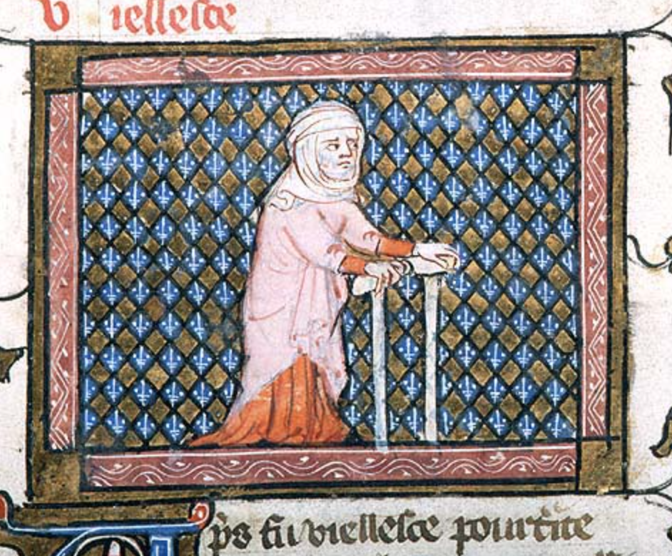 Medieval manuscript image of a white-bearded man wearing a hood with wimple, supporting himself with crutches that he holds in his hands.